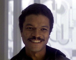 Afrofuturism man smiling white background - a white wall behind free wallpaper
