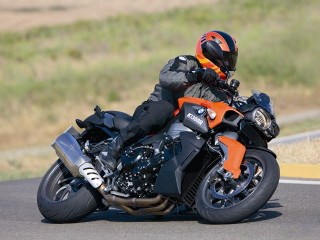 Man riding motorcycle curvy road - a motorcycle free wallpaper