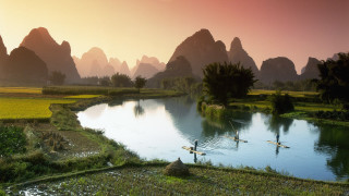 Paddle boarding river mountains grass - a sunset free wallpaper
