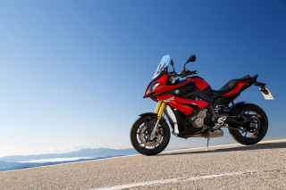 Red motorcycle mountains blue sky - a red motorcycle free wallpaper