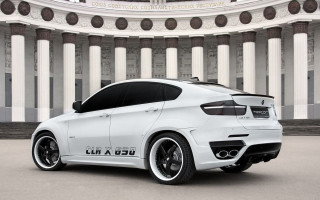 White bmw suv parked building - column and columns free wallpaper
