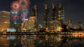 City skyline fireworks lake reflection - a city skyline free wallpaper