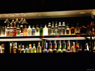 Bar bottles liquor shelves light - neon free wallpaper