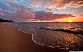 Sunset beach waves walking person - the beach in the distance free wallpaper
