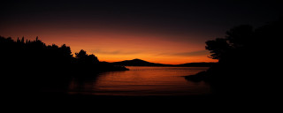 Sunset mountain water trees foreground - a sunset free wallpaper