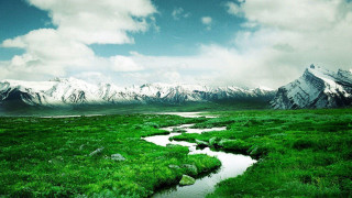 Stream lush field mountains snow 2 - a stream free wallpaper
