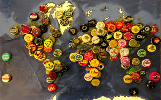 Bottle caps magnets world map - international typographic style free wallpaper for desktop