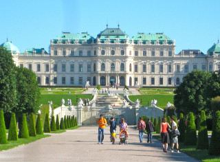 Large building fountain people walking 3 - it in front free wallpaper
