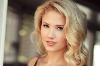 Blonde blue eyes woman camera - free portrait wallpaper
