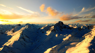 Mountain range sunset plane window 2 - a view of a mountain range free wallpaper