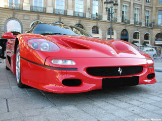 Red sports car parked street - edi rama free wallpaper