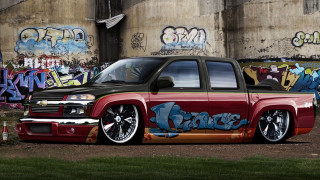 Red truck graffiti building walls - a red truck free wallpaper