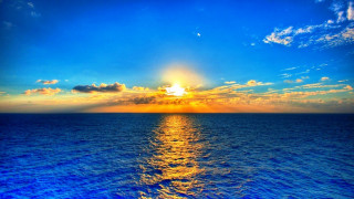 Sunset ocean clouds water blue - a sunset over the ocean free wallpaper