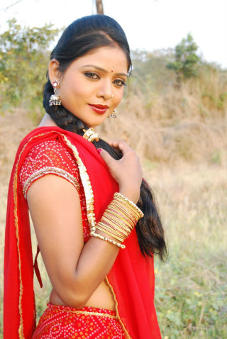 Woman red sari gold jewelry - movie still frame free wallpaper