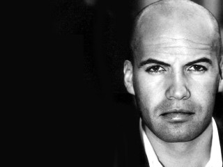 Bald man suit serious expression - hypermodernism free wallpaper