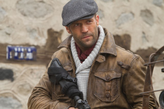 Man holding camera brown jacket - brown free wallpaper