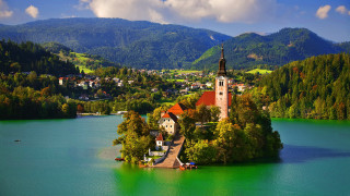 Small island church lake mountains 6 - the middle of a lake free wallpaper