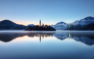 Small island church sunset fog - a small island in the middle of a lake free wallpaper