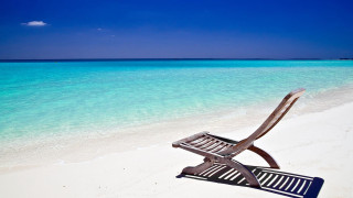 Chair beach ocean blue sky 2 - a white sand beach free wallpaper