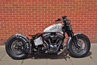Motorcycle parked brick wall sidewalk - ed roth free wallpaper