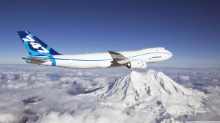 Jetliner flying mountain clouds snow - free airplane wallpaper