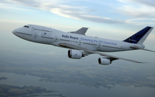 Jetliner cloudy sky water background - a large jetliner free wallpaper for desktop