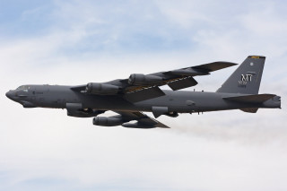 Military plane flying smoke wings - a large military plane free wallpaper