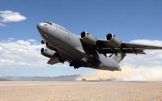 Jetliner desert truck blue sky - hard surface free wallpaper