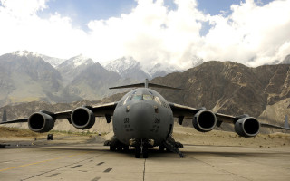 Jetliner airport tarmac mountains clouds - pathfinder free wallpaper