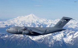 Military plane mountain range sky - a large military plane free wallpaper