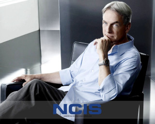 Man sitting chair hand chin 8 - andrew bell free wallpaper