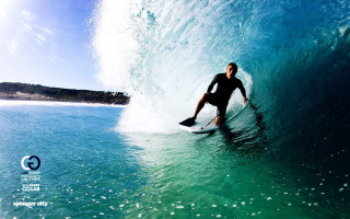 Surfing wave ocean sunny day 2 - top of a surfboard in the ocean free wallpaper