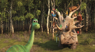 Dinosaur forest trees bushes background - a man in the foreground free wallpaper