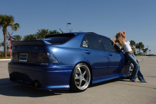 Woman blue car parking lot - a picture free wallpaper for desktop