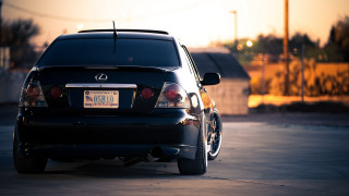 Black car parking lot sunset 3 - a black car free wallpaper
