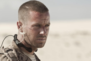 Man earbuds looking distance desert - movie still free wallpaper