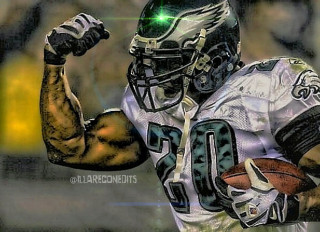Football player holding football green 2 - a football player free wallpaper