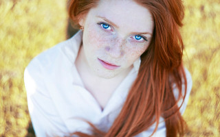 Woman freckles blue eyes field - freckle free wallpaper