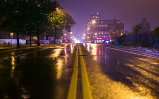 Wet street night cityscape lights - a yellow line free wallpaper