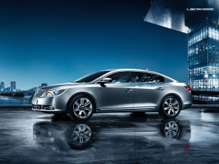 Silver car tall building night - a silver car free wallpaper