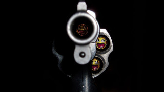 Gun smiley face barrel cap - a close up of a gun free wallpaper