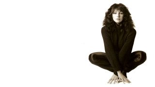 Woman sitting floor legs crossed 5 - barbara nessim free wallpaper