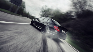 Black car road trees cloudy - a black car free wallpaper