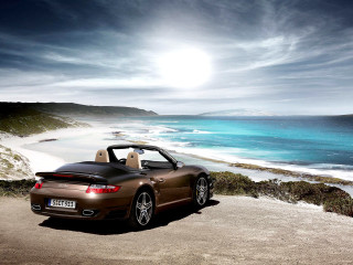 Brown sports car ocean beach - a sun free wallpaper