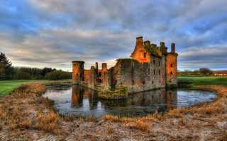 Castle lush green field river - romanesque free wallpaper