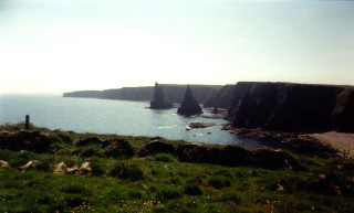 Grassy field water cliff boats - a few boat free wallpaper
