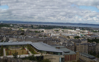 City buildings water clouds sky - panoramic view free wallpaper