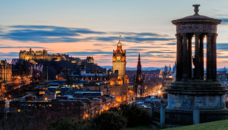 City clock tower night skyline - a city skyline in the background free wallpaper