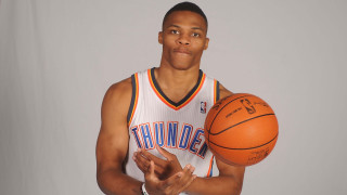 Man holding basketball smiling happy - his hand and a ball free wallpaper