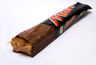 Chocolate bar bite white surface - a bite free wallpaper
